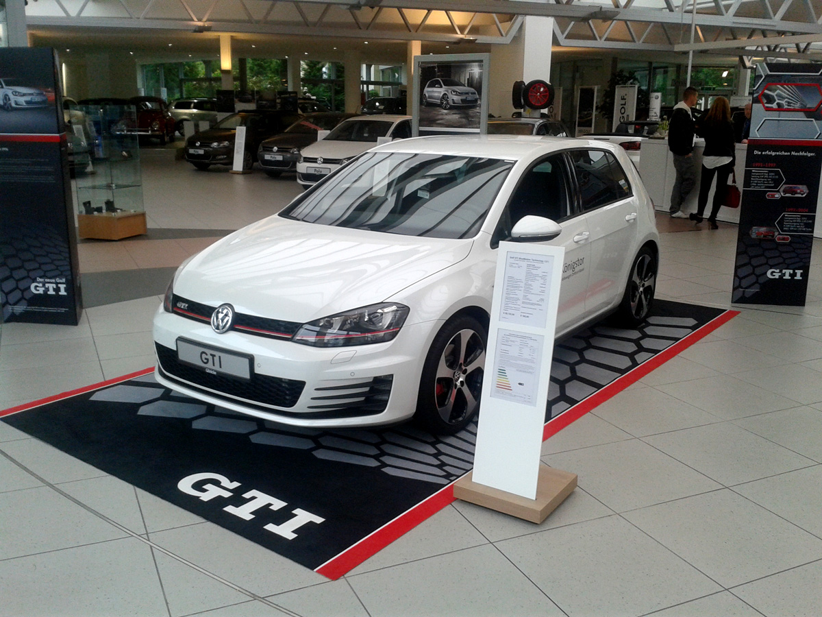 Car presented on a printed felt mat